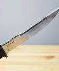 Close-up of Outdoorsman Lite 6 Inch Fixed Blade Knife with 4116 Stainless Steel, textured Kraton handle, angled blade view.