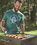 Man grilling on Park Style Charcoal Grill For Camping And Backyard Outdoor Cooking Portable Patio Barbecue 20.5 By 20.5 By 8.25 Inches