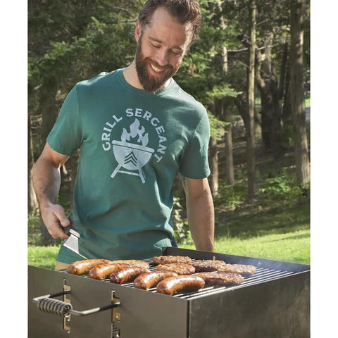 Man grilling on Park Style Charcoal Grill For Camping And Backyard Outdoor Cooking Portable Patio Barbecue 20.5 By 20.5 By 8.25 Inches