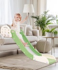 Built Tough Toddler Couch Slide For Bedroom And Family Room Safe Hdpe Indoor Play Ramp With Secure Side Rails Holds Up To Two Hundred Twenty Pounds No Sweat Setup And Compact Storage Look In Cool Green And White, child using slide in bright living room.