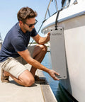 Man attaching Premium EVA Foam Docking Cushion Protector For Boats And Yachts Water Resistant Guard to boat side at dock