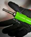 Green Earth Drill Adapter For Auger And Soil Drills With SDS Plus Chuck held by gloved hand