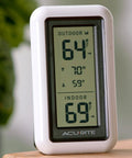 Digital Indoor Outdoor Thermometer With Wireless Sensor LCD Display And Daily High And Low Temperature Readings No Fuss Setup And Monitoring For Home Or Office White standing on a table.