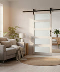 Frosted Glass Sliding Barn Door With Five Lite Panels Six Foot Hardware Kit And Handle Included Solid Wood Core Covered With Waterproof PVC Surface Sleek Modern Look And Easy Install For Bathroom And Kitchen installed in living room.