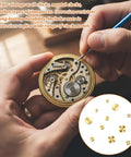 Person using tool on clock mechanism with Brass Clock Hand Nut Set 12 Pcs Assortment For Quick Clock Fixes on display