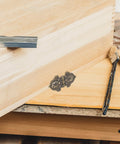 Golden Zinc Alloy Hinges Set Retro Decorative 10 Pieces for Wood Boxes displayed on a wooden box with tools nearby.
