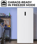 Big Boy Upright Freezer With Convertible Fridge Mode, Four Handy Shelves, Garage Ready No Hassle Defrost, Loads Of Room For Meat Cuts, Massive 21 Cubic Foot Capacity, White in garage setting.