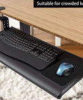 Tiny 6 By 8 Inch Mouse Pad For Laptop And Travel on a pull-out keyboard tray with a keyboard and mouse