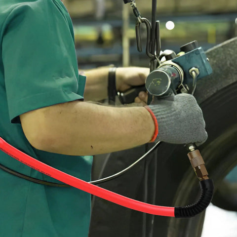 Mechanic using Hybrid Air Hose 3/8 Inch by 100 Feet For Air Compressors, Heavy Duty and Lightweight Workhorse, 300 PSI in workshop