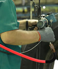Person using Hybrid Air Hose For Air Compressors Three Eighths Inch By Fifty Feet Built To Last Heavy Duty Lightweight in a workshop