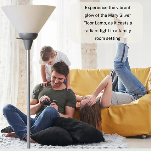 Mary Torchiere Floor Lamp With Opal White Cone Shade in living room setting with family relaxing on sofa, silver pole visible