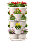 Five Tier Vertical Stackable Garden Planter For Strawberries Flowers Herbs And Veggies In Ivory Finish seen outdoors.