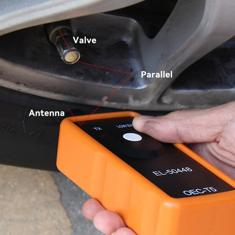 Heavy Duty Tpms Relearn Tool Oec-T5 For No Mess Automotive Tire Pressure Sensor Activation Reset And Dead Easy Programming Setup Fits Virtually Any Ride Orange in use, showing valve and antenna.