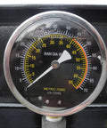 Real Deal 40 Ton Air Hydraulic Shop Press gauge displaying pressure levels for precision automotive repairs with measurement details.