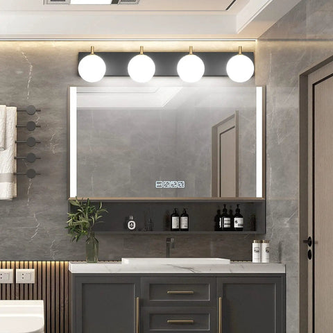 Mid Century Modern Four Light Vanity Light With Milky Glass Globes Over Mirror Dope Vintage Style Bathroom Fixtures Featuring Gold Pole And Matte Black Base For Soft Uniform Illumination in bathroom setting.