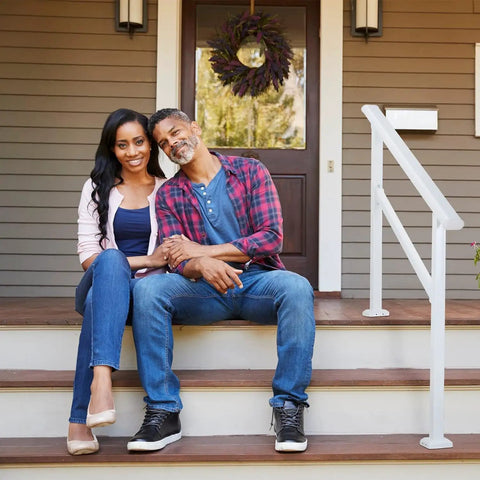 Couple sitting on porch steps with sturdy outdoor and indoor stair handrail kit for 1 to 2 steps, safety hand rail for porch and deck.