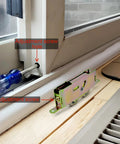 Tandem Replacement Sliding Patio Door Rollers Kit with 1-1/4 Inch Steel Ball Bearing Wheels installed and being adjusted with screwdriver