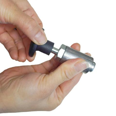 Close-up of hands holding a Heavy Duty Steel Pull Pin With Welded Barrel Handle And Black Spring Plunger for easy operation.