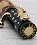 Kickin DIY Woodturning Project Kit Featuring Five Ceramic Flag Ballpoint Pen Hardware Sets And Precision Bushings For Turning Custom Writer Accessories, close-up of pen with black and gold design.