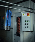 12V Max Lithium Ion Battery 2Ah Pack Two Battery Pack For Power Tools hanging in industrial setting near control panel
