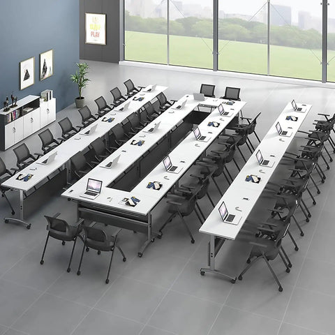 Game Changer Folding Mobile Conference Table With Privacy Panel And Heavy Duty Locking Casters Flexible Workstation Setup For Home Office Or Classroom Use In Packs Of Four Tables arranged for meetings with laptops.