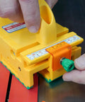 Close-up of GRR Ripper Safe Rip Upgrade Kit For Table Saw Safety showing orange cursor and green adjustment knob in use.