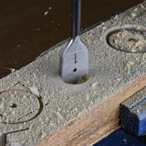 Close-up of Spade Drill Bits Set 3/8 To 1 Inch For Wood Plastic Aluminum With 1/4 Inch Hex Shank Paddle Flat Bits in use on wood