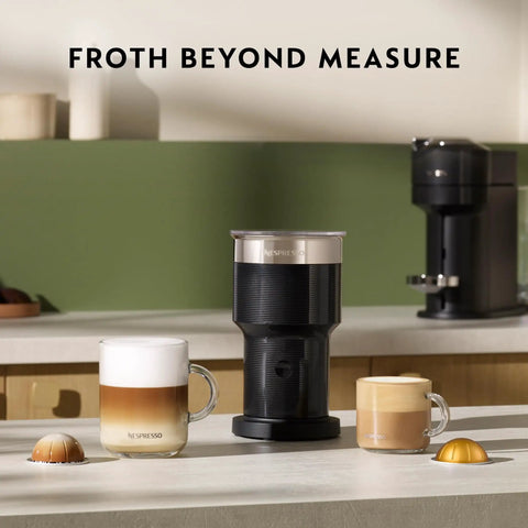 XL Milk Frother With Three Froth Modes For Latte And Cappuccino Hot Foam Cold Foam And Hot Milk 7.6 Oz Foam Capacity 13.5 Oz Hot Milk Dishwasher Safe Easy Clean Ideal Home Barista Tool on a kitchen counter with coffee mugs.