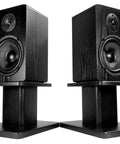 Heavy Duty 8 Inch Desktop Speaker Stands With 66 Pound Capacity, Isolation Pads, Cable Management, Built For Studio Monitors And Bookshelf Speakers, Solid MDF Core, Premium Finish, Stable, Vibration Free with two speakers on stands.
