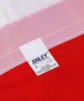 Fly Breeze 3x5 Foot American National Flag with fade-proof colors, close-up of canvas header and brass grommet, brand label visible