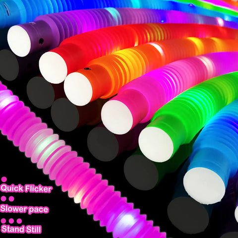 Glow Pop Tube Wand Toys For Kids And Toddlers Six Color Light Up Tubes in different modes on a dark background.