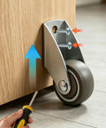 Four Pack Of One Point Five Inch Rigid Caster Wheels With Rock Hard Stainless Brackets And Smooth As Butter Rubber Tires secured under a workbench.
