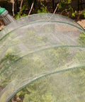 20Ft By 25Ft Fine Mesh Garden Netting With Insect Barrier over green plants in backyard setup