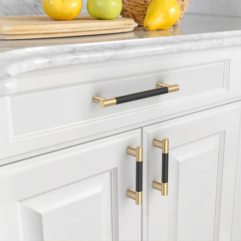 Ten Pack Five Inch Knurled Black And Gold Cabinet Handles For Kitchen Cabinets And Drawers Durable Pulls With Easy Grip Cupboard Hardware For A Modern Sleek Look 128mm Center To Center Fit installed on white cabinets