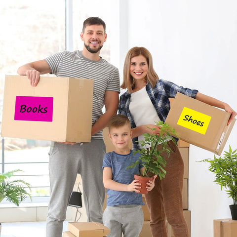 Family holding boxes labeled with Big 5x3 Inch Blank Labels For Storage Bins, 240 Pack With 10 Colors Writable Organizing Labels