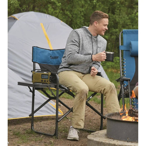 Person sitting on Oversized Tall Director Chair For Camping And Tailgating, Heavy Duty Folding Camp Chair with 500 Lb Capacity