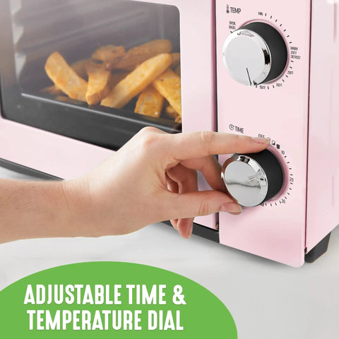 Hand adjusting Pink Mini Oven With Healthy Ceramic Nonstick Coating, Compact Countertop Bake Broil Toast Pizza Maker