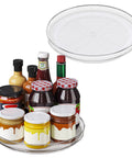 Nine Inch Clear Lazy Susan Set Of Two Round Rotating Turntable Organizers With Non Slip Base For Pantry Cabinet And Fridge Shelf, displaying various jars and condiments.