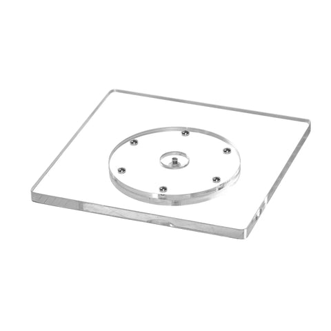 Slick Square Acrylic Cookie Decorating Turntable With Anti Slip Silicone Mat Easy Peasy Setup Kitchen Gamechanger Crystal Clear Lazy Susan Platter For Frosting Cupcakes, clear acrylic turntable viewed from above.