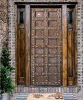 Hand Carved Rustic Authentic Doors For Interior And Exterior Use Antique Barn Door Style Custom Size 71 By 34 Inches Sliding Or Hinged Double And Single Rustic Doors No Glass No Hardware Included front view on stone wall with indoor plant