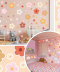 128 Pcs Colorful Flower Wall Sticker Set With Groovy Retro Hippie Vibe Boho Daisy Decals In Three Sizes on pink nursery wall.