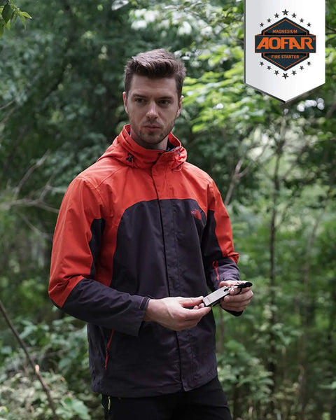 Man holding AF-374 Two Pack Magnesium Fire Starter With Waterproof Fire Steel Pouch in forest setting.