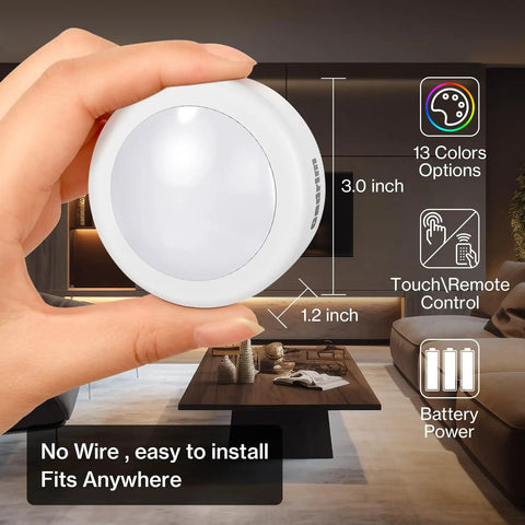 Person holding Color Changing LED Puck Lights With Remote Control, Dimmable Under Cabinet Kitchen Lighting, Battery Powered, 1 Pack