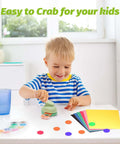 Child using 1 Inch Circle Hole Punch For Crafts And DIY Arts, Handy Lever Action Paper Punch, on colorful paper with circles cut out