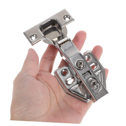 Person holding Stainless Steel Hidden Door Hinge With Soft Close Mechanism For Kitchen And Bathroom Cabinets Built To Last Durable Material Easy Installation And Smooth Damping By HOMSFOU