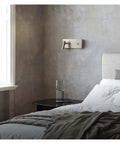 Slick LED Wall Sconces Infinite Dimming Switch Metallic Nickel Aluminum Build installed in modern bedroom for bedside reading.