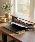 Adjustable Reusable 5M Hook and Loop Cable Ties for Quick Cord Management securing cables behind a desk with laptop and mug.