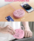 Total Game Winning Pink Extension Cord With Usb C Power Strip Five Foot Smart Charging Hub and Multiport Surge Protector on a wooden desk.
