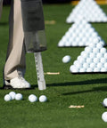 Shag Bag For Golf Balls With Detachable Aluminum Tube in use on practice green, collecting loose golf balls efficiently.