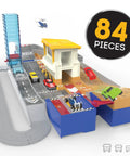 Collapsible Racetrack Playset With 6 Mini Cars, 84-Piece Track Kit shown set up with race car and monster truck on tracks.